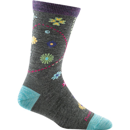 A single Darn Tough Garden Light Crew Grey sock adorned with colorful floral patterns and light blue accents at the toe and heel areas.
