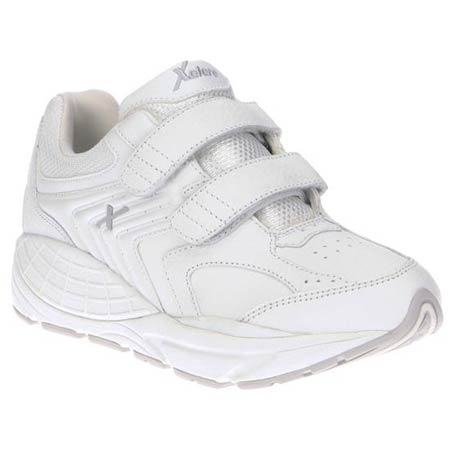 A single white XELERO MATRIX STRAP WHITE - WOMENS sneaker with velcro straps and a cushioned sole, displayed against a white background.