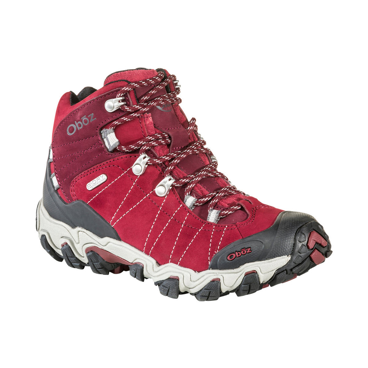 A red and gray Oboz Bridger Mid Bdry Rio Red hiking boot with metal eyelets and a rugged sole, featuring B-DRY waterproofing and a logo on the side.