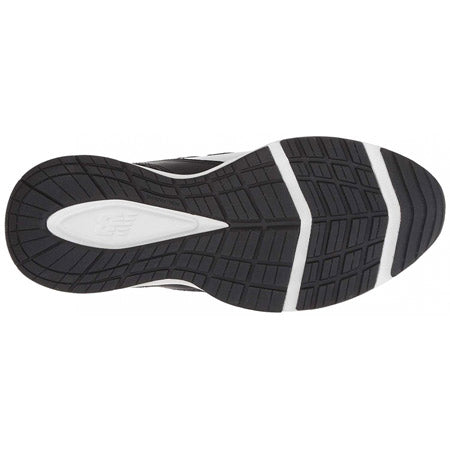 Bottom view of a black and white rubber sole of a New Balance X608v5 cross-training shoe, displaying a geometric tread pattern for grip.