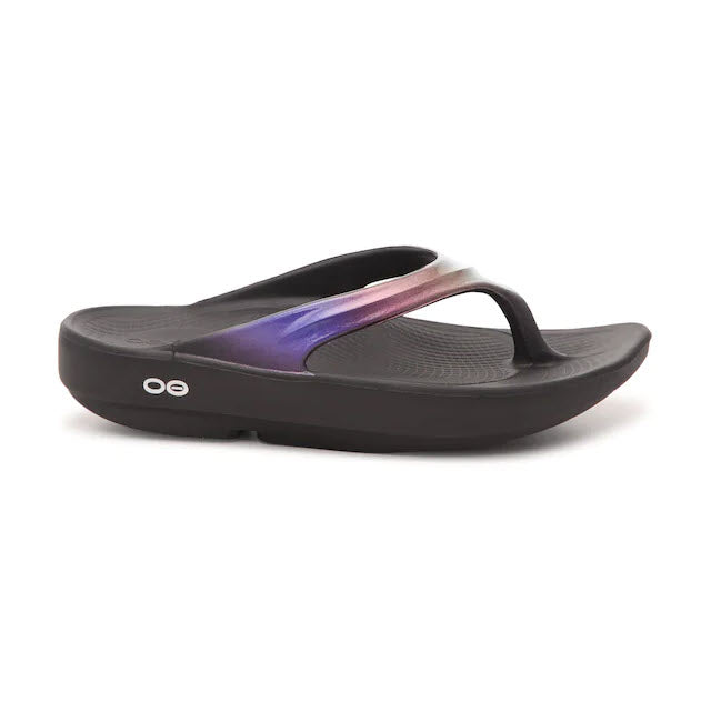 A single Oofos OOlala Luxe Black/Atlantis Women's sandal with a glossy purple strap, isolated on a white background.