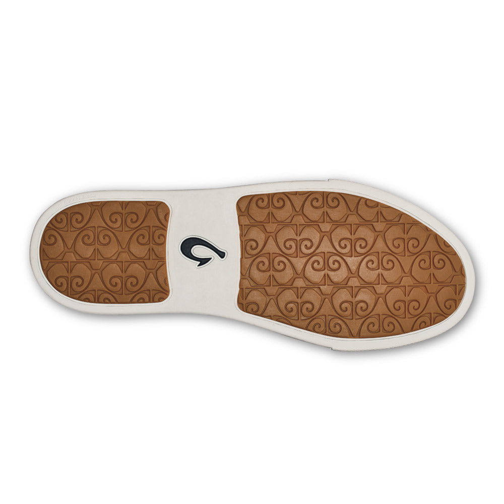 A pair of Olukai Pehuea Li Trench Blue orthotic insoles with a non-marking rubber outsole, isolated on a white background.