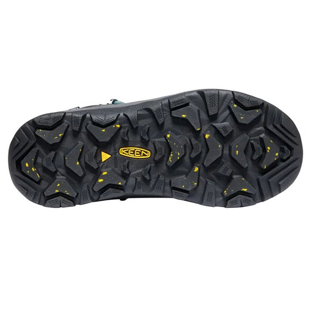 Treaded sole of a KEEN REVEL IV MID POLAR MAGNET/NORTH ATLANTIC insulated boot, featuring a black and gray pattern with yellow details.