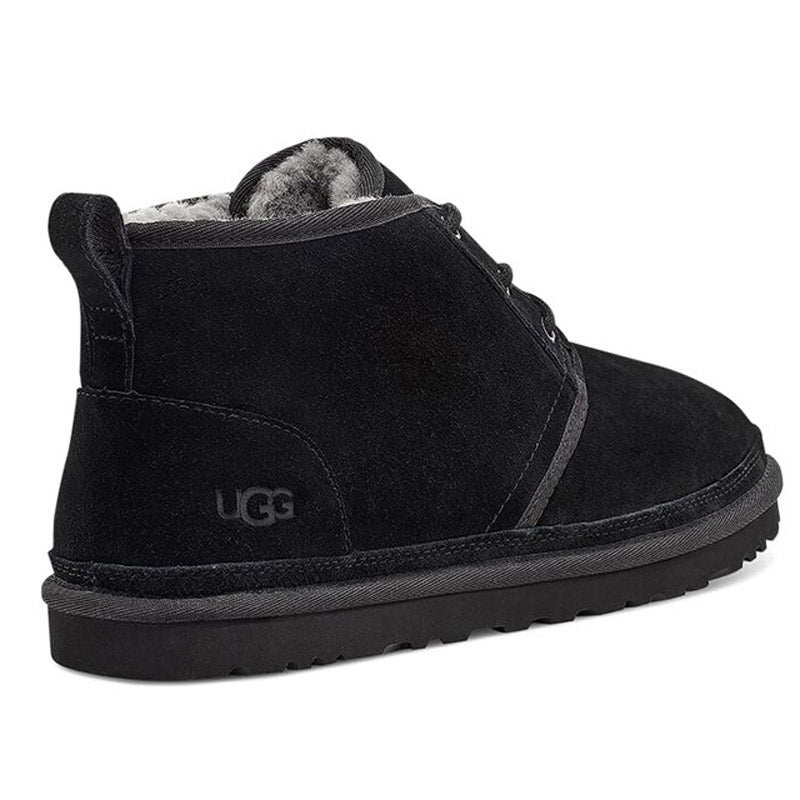 Black Ugg Neumel Chukka Boot in suede with a plush lining and a thick rubber sole, viewed from the side.