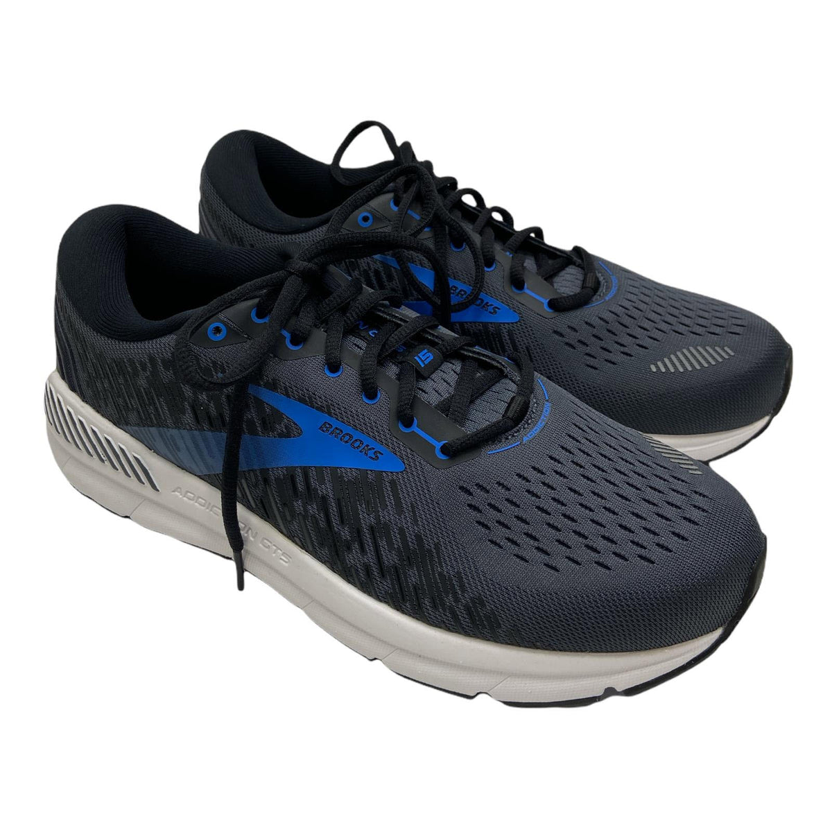 A pair of black and blue Brooks Addiction GTS 15 (Ink/Black) running shoes with GuideRail technology for overpronators, featuring laces on a white background.