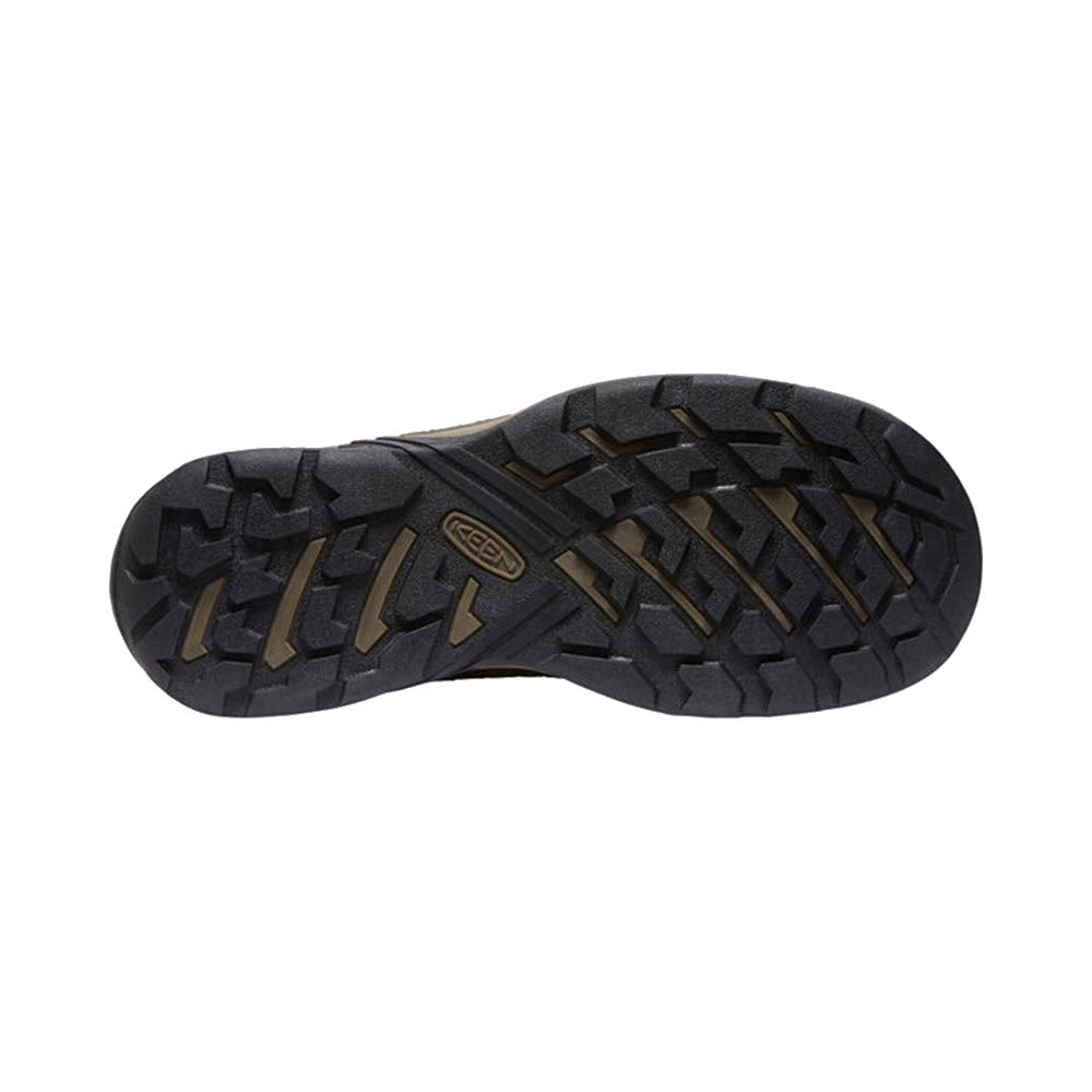Bottom view of a black waterproof KEEN CIRCADIA hiking shoe sole with a distinct tread pattern and a Keen logo embossed in the center.
