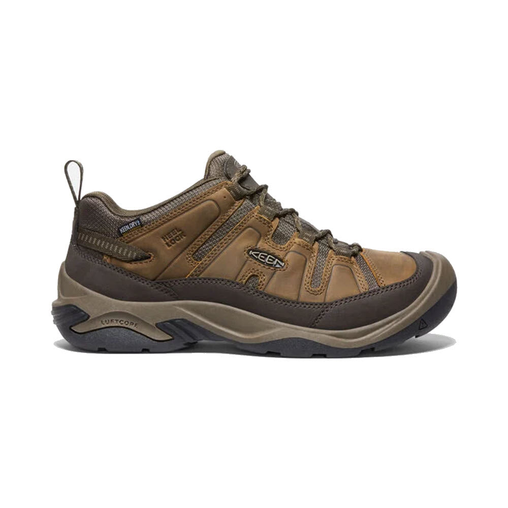A side view of a single Keen Circadia WP Shitake hiking shoe featuring brown leather and synthetic materials, and a black rubber sole.