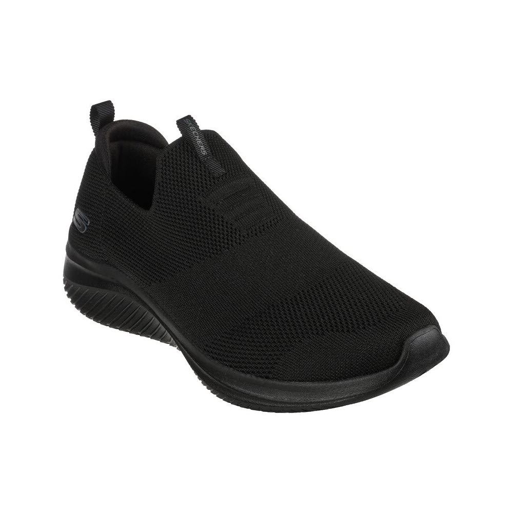 Skechers Ultra Flex 3.0 black slip-on sneaker with a mesh upper and rubber sole, featuring a small logo on the side and equipped with Air-Cooled Memory Foam for added comfort.