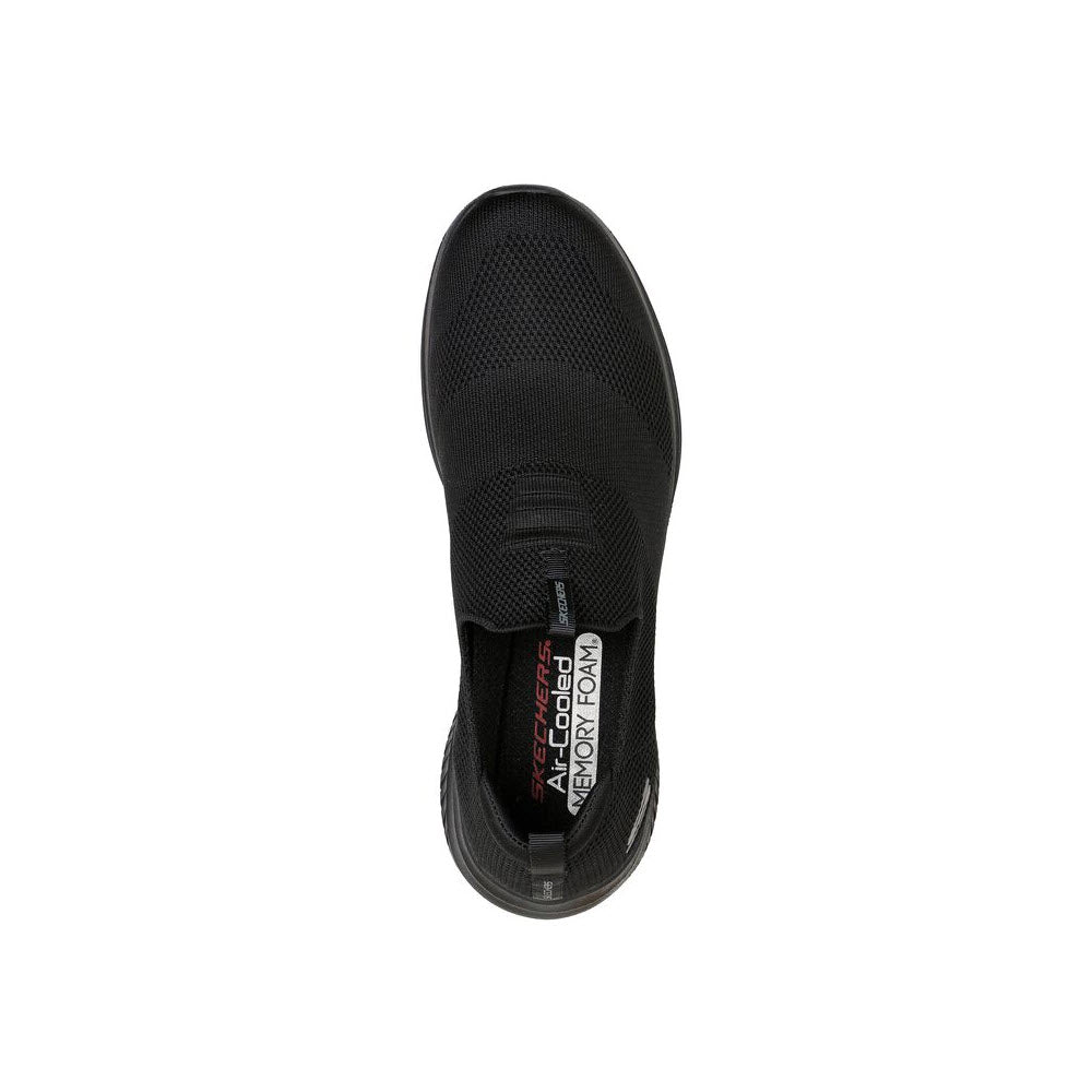 Top view of a single Skechers Ultra Flex 3.0 black athletic shoe featuring Air-Cooled Memory Foam and a visible Skechers brand tag on the heel.