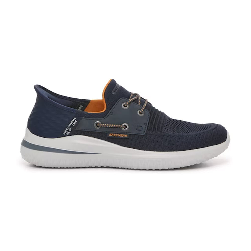 Navy blue Skechers ROTH Low Profile Bungee Lace Slip-Ins casual boat shoe with Air-Cooled Memory Foam, white soles, and orange interior accent, displayed against a white background.