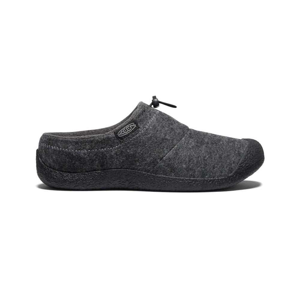 A single Keen Howser III Slide Charcoal Grey Felt - Mens slip-on with a black rubber sole, featuring a visible Keen logo on the side and cozy fleece lining, displayed against a white background.