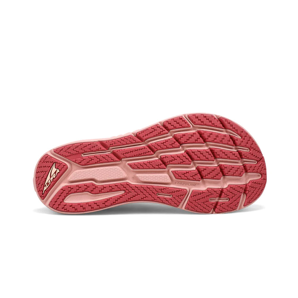 A vibrant coral-colored Altra Torin 7 Deep Teal/Pink sole with a herringbone pattern and a triangular logo on the heel area.