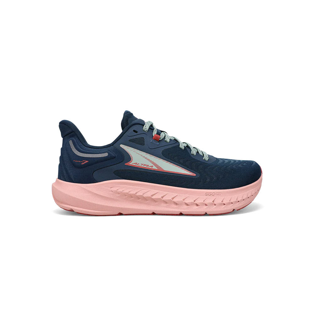 A navy blue and coral pink Altra Torin 7 running shoe with a thick sole and lace-up front, featuring the dynamic Altra logo on the side.