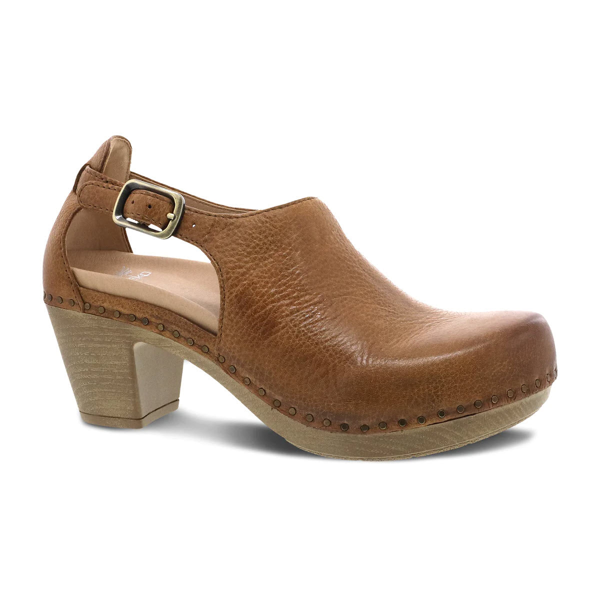 A brown high-quality leather clog with a buckle, wooden heel, and studded detail around the sole - Dansko Sassy Tan Womens.