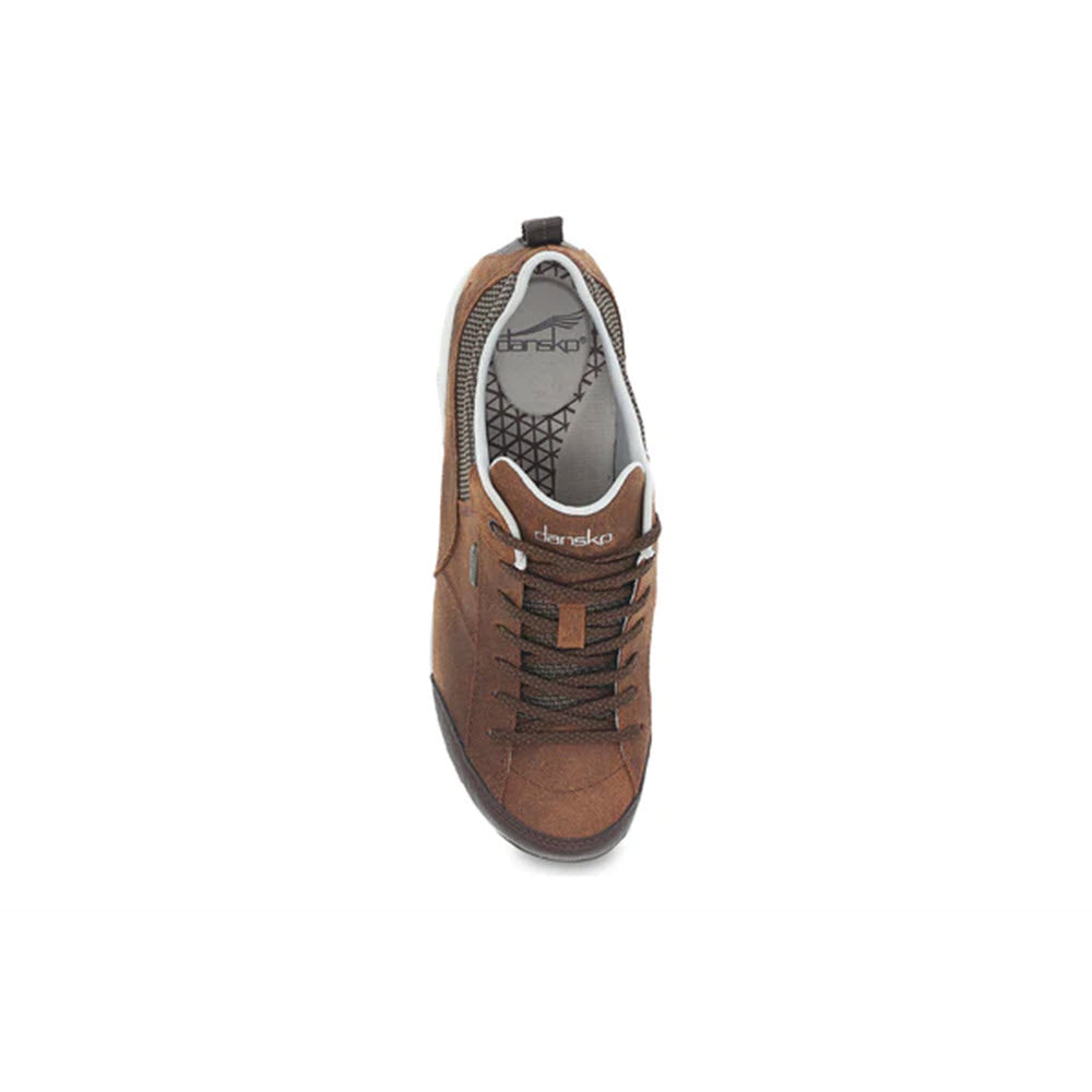Top view of a single brown leather Dansko Paisley sneaker with laces on a white background.