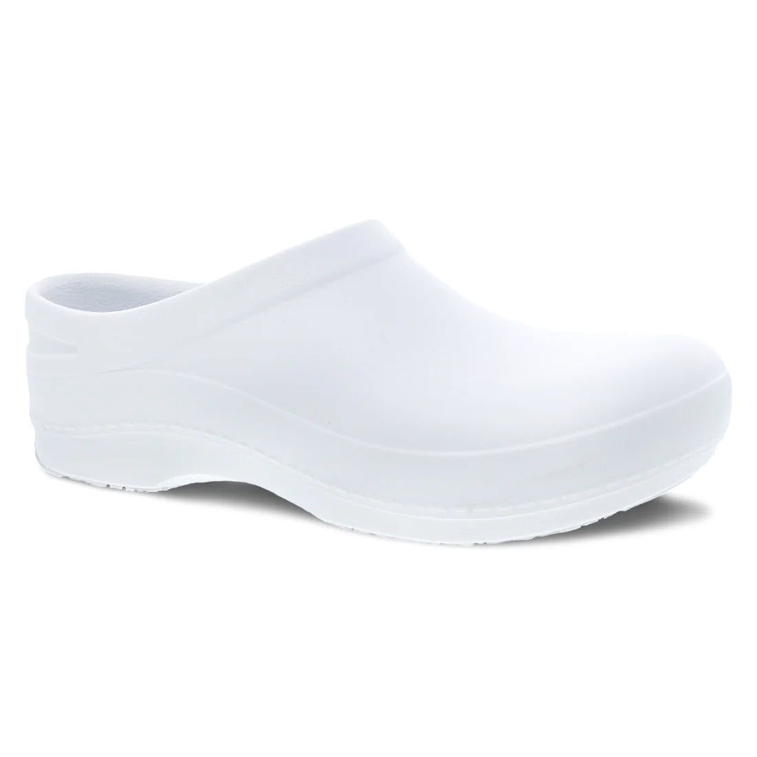 A white, slip-resistant clog-style work shoe with a Dansko Natural Arch® on a white background. - A DANSKO KACI WHITE - WOMENS on a white background.