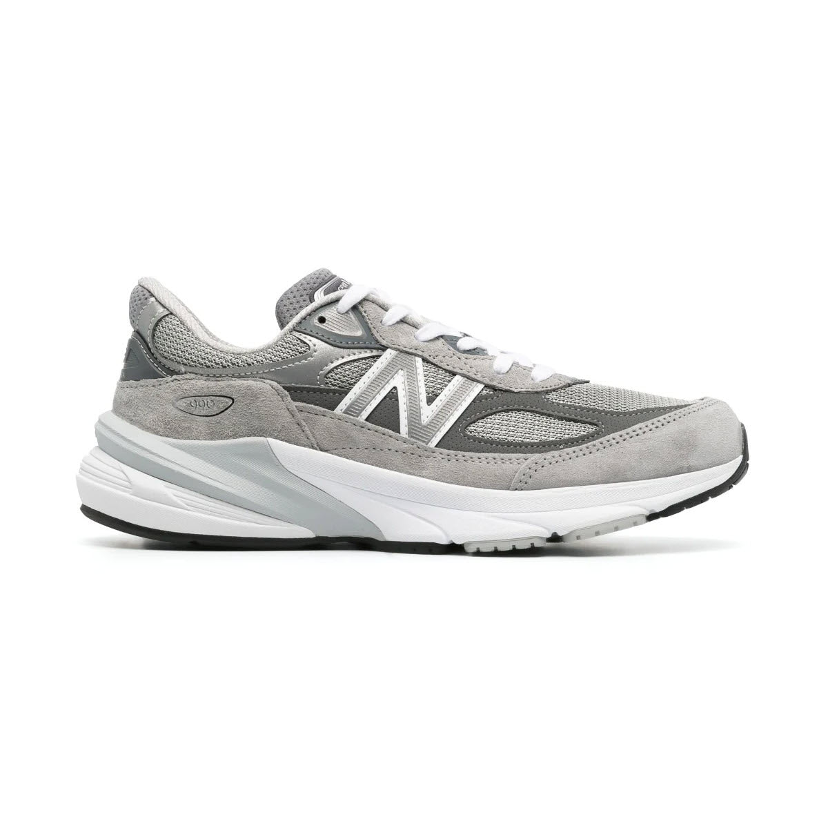A New Balance NEW BALANCE 990 V6 running shoe in gray and white, featuring a mesh upper and ENCAP midsole cushioning, displayed against a white background.