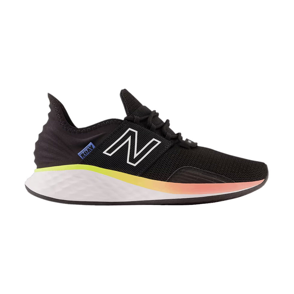 A single black New Balance Fresh Foam Roav running shoe with an Ultra Heel design and a vibrant color gradient from yellow to pink on the midsole, isolated on a white background.