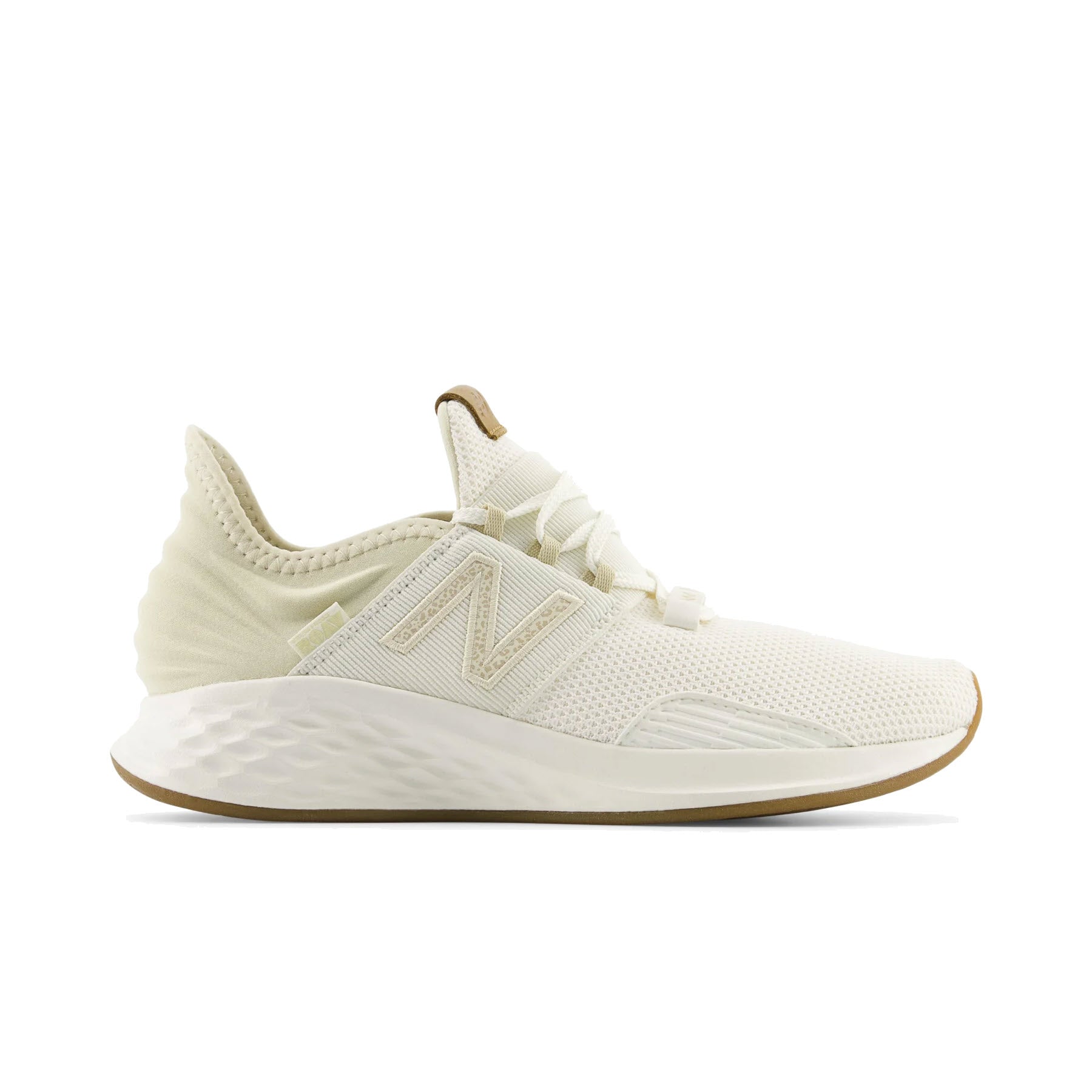 A single beige New Balance Fresh Foam Roav Turtledove/Sea Salt running shoe with an Ultra Heel design displayed against a white background, featuring a mesh upper and a prominent logo on the side.