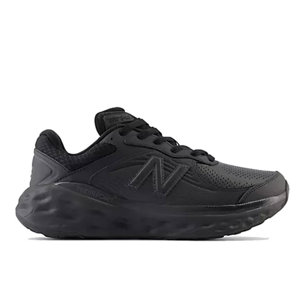 A side view of a black New Balance Slip Resistant Fresh Foam X 840V1 walking shoe with a cushioned fresh foam sole.
