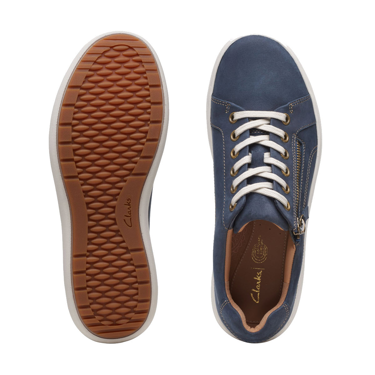 A pair of blue Clarks Nalle Lace Navy sneakers with white laces, displayed with one shoe facing up and the other showing the sole.
