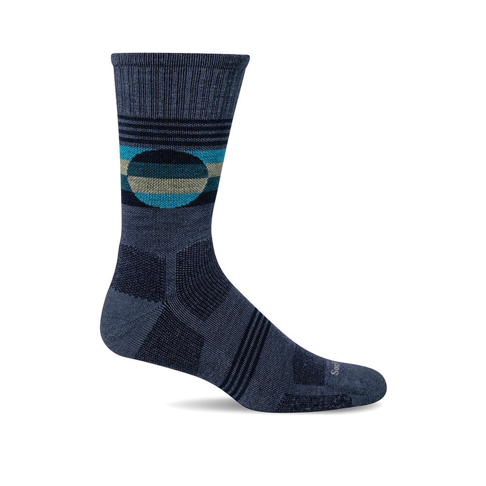 A single Sockwell North Rim 15-20 mmHg Compression Crew Sock in Denim for men with a moderate compression, a geometric pattern, and teal accents, displayed against a white background.