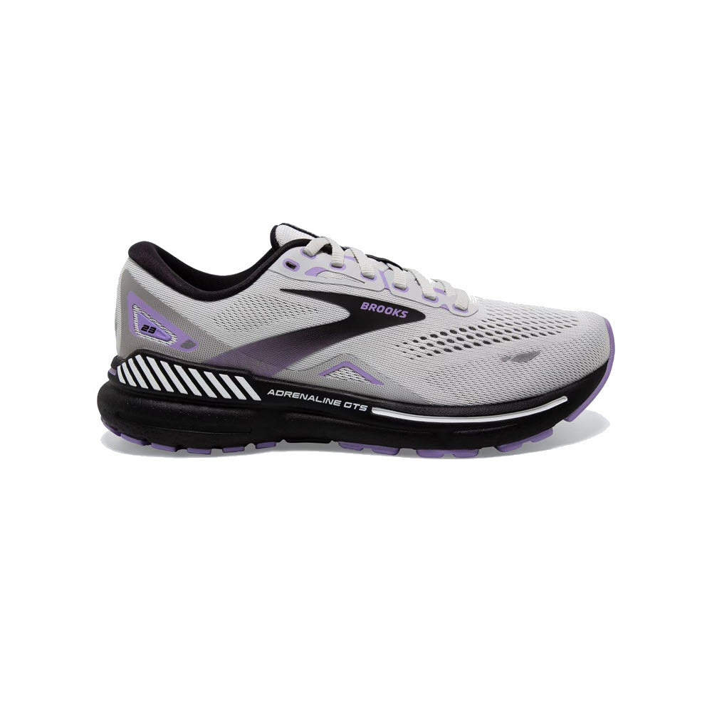 White and purple Brooks Adrenaline GTS 23 women&#39;s running shoe isolated on a white background.