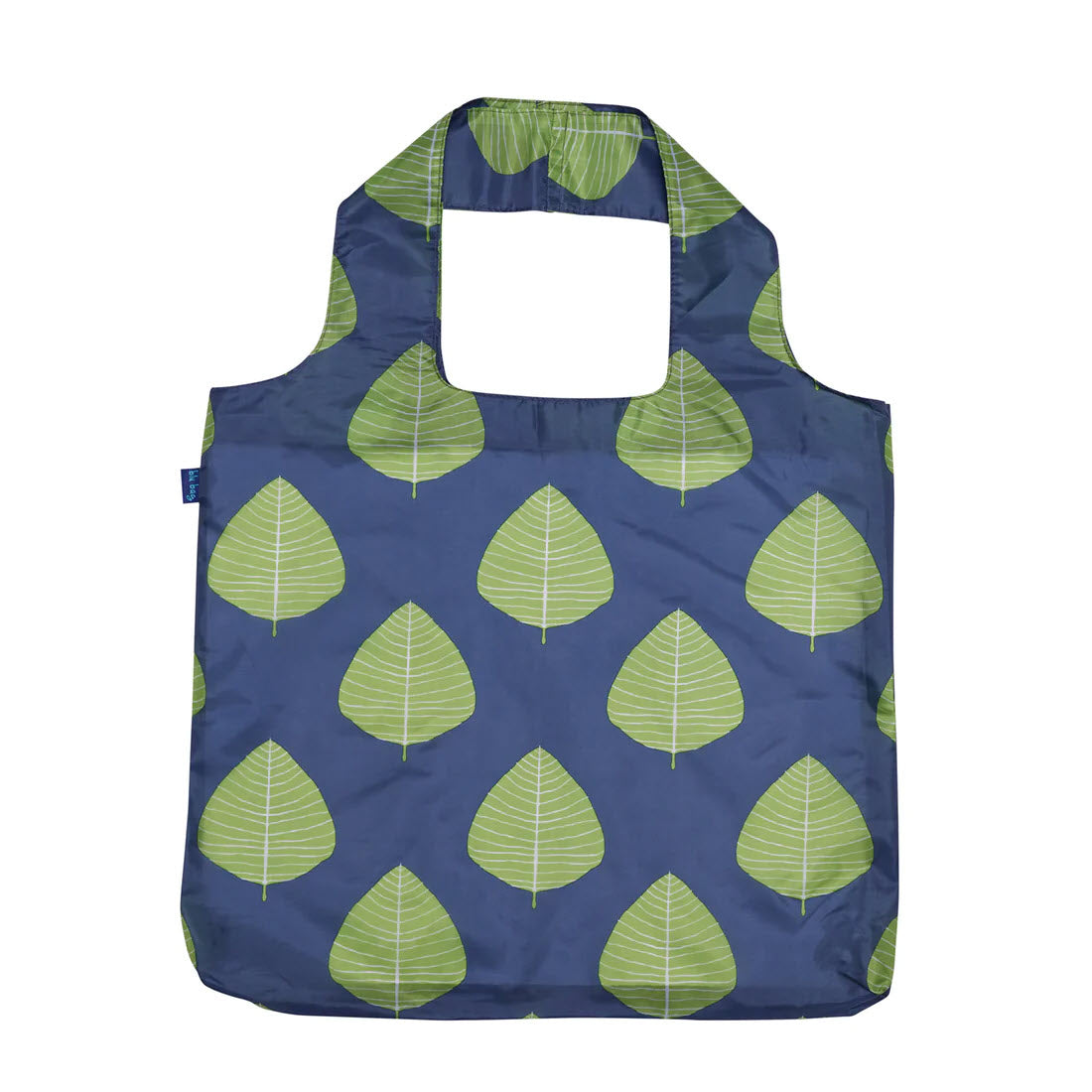 A reusable shopping bag with a dark blue background and a pattern of green leaf prints, featuring built-in handles and designed as the Rockflowerpaper BLU BAG ASPEN LEAVES eco-friendly tote.