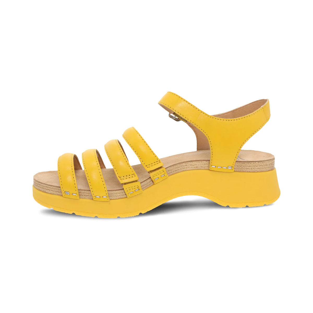 Dansko Roxie Yellow strappy sandal with a chunky sole on a white background.