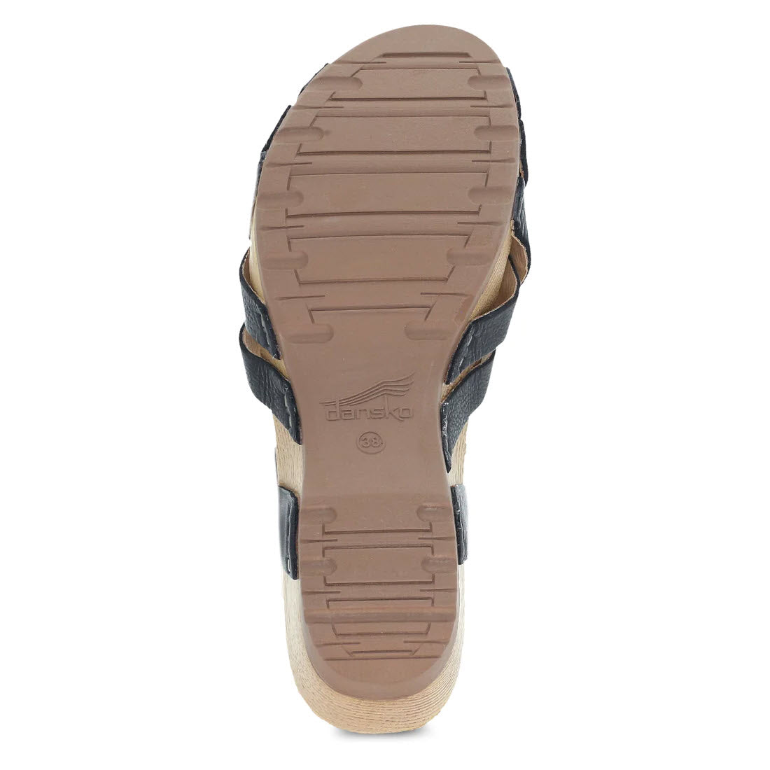 Bottom view of a single Dansko Tinley Black sandal with an adjustable strap and a chunky chic brown rubber sole, displaying the brand logo.
