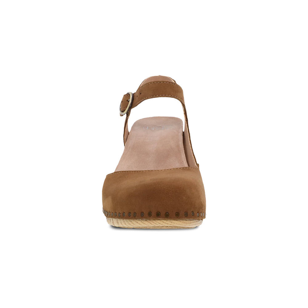 A single brown suede Dansko Taytum Tan - Womens heeled sandal with a strap and buckle viewed from the front.