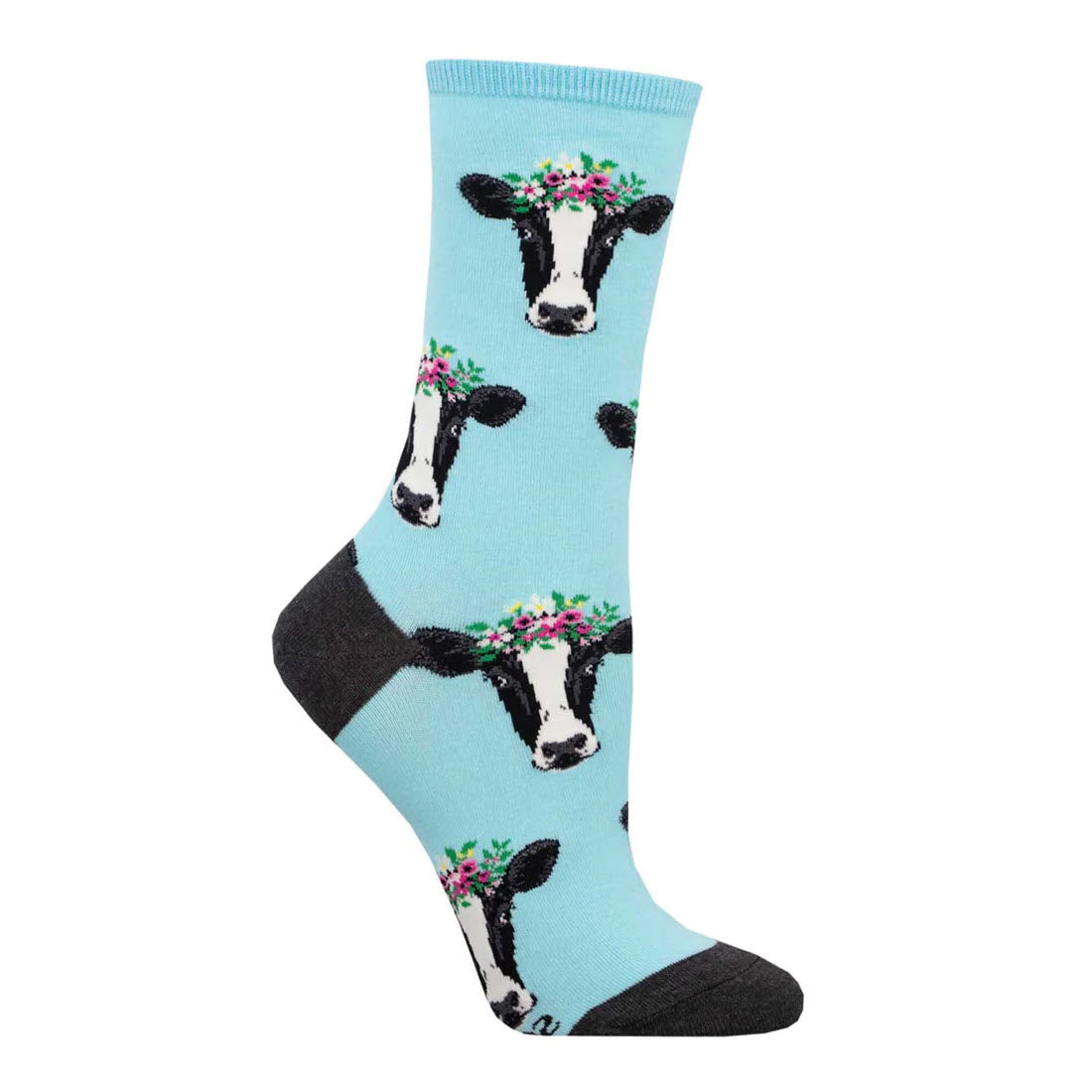 A fabulous Socksmith Wow Cow Crew Sock in light blue featuring a pattern of cow faces adorned with floral crowns, with a dark gray toe section.