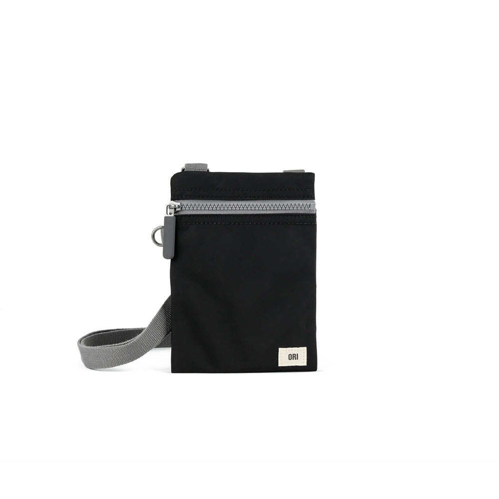 ORI LONDON CHELSEA CROSSBODY BLACK vertical shoulder bag with a gray strap and silver zipper, made of recycled material, featuring a logo at the bottom.