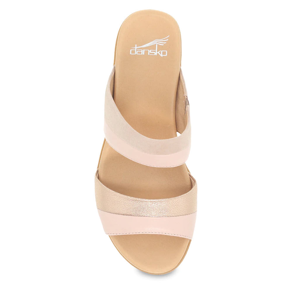 Top view of a beige Dansko Theresa Blush Multi sandal with crisscross straps and an anytime heel, displayed on a white background.