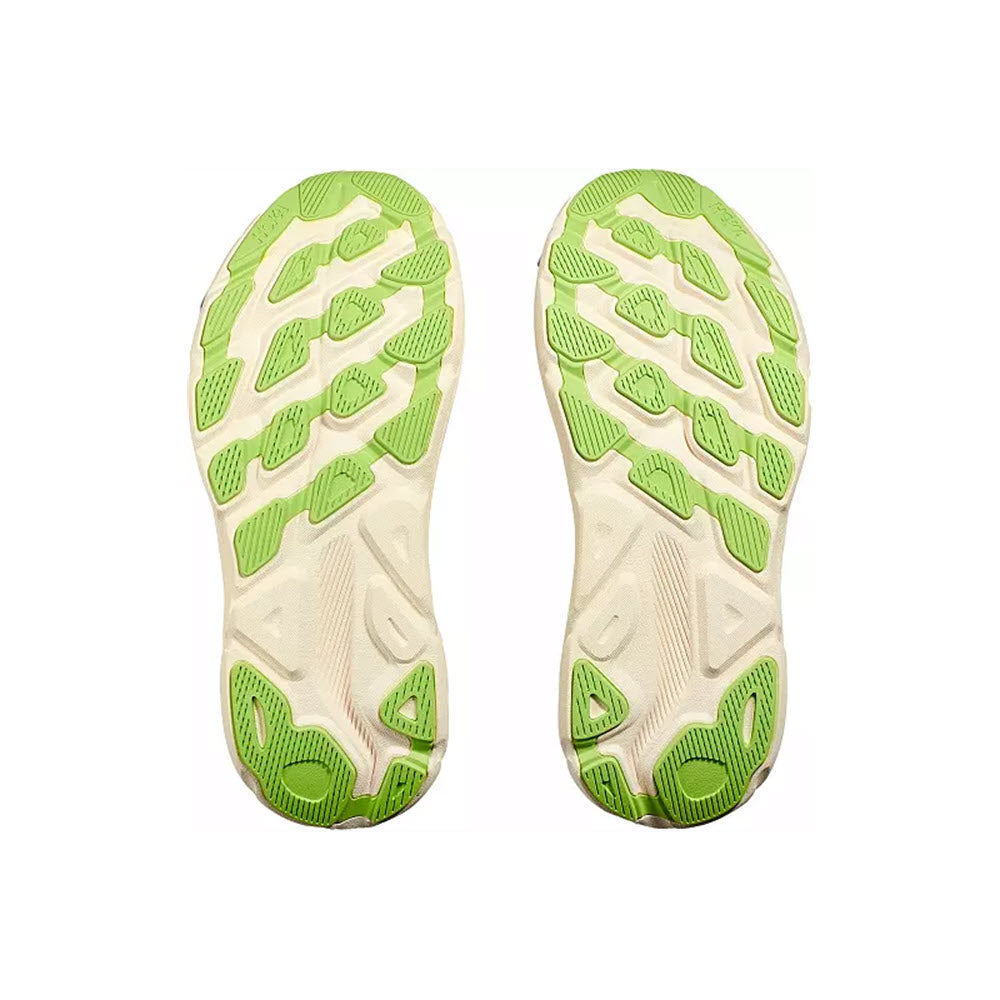 A pair of lime green and beige Hoka Clifton 9 rubber shoe soles displayed against a white background, featuring an improved outsole design.