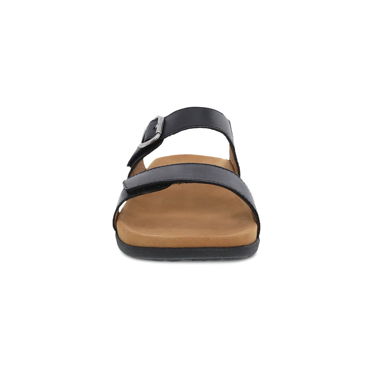 A single Dansko Justine Black slide sandal with a buckle, viewed from the front, isolated on a white background.