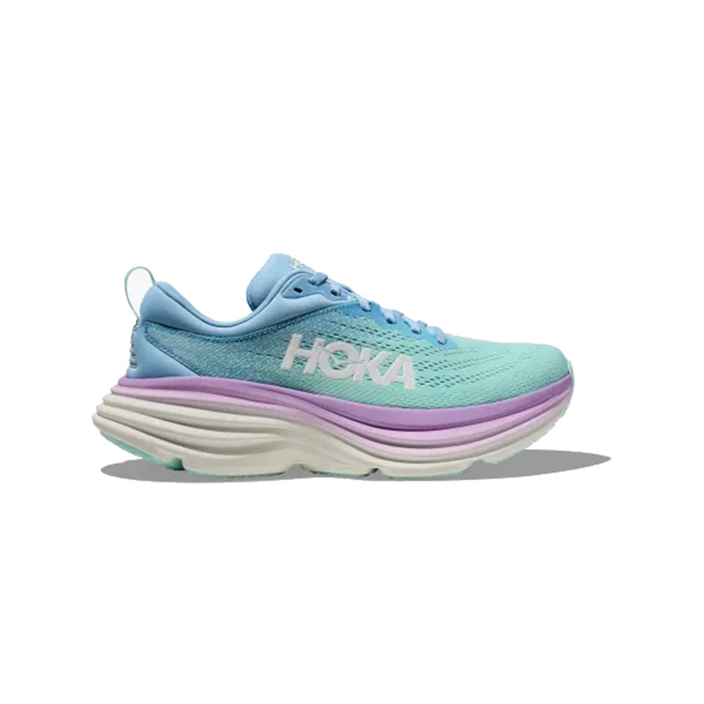 Light blue HOKA BONDI 8 AIRY BLUE/SUNLIT OCEAN - WOMENS athletic sneaker with a white sole, purple midsole accent, and &quot;Hoka&quot; branding on the side. The shoe has a textured upper and a pull tab at the heel.