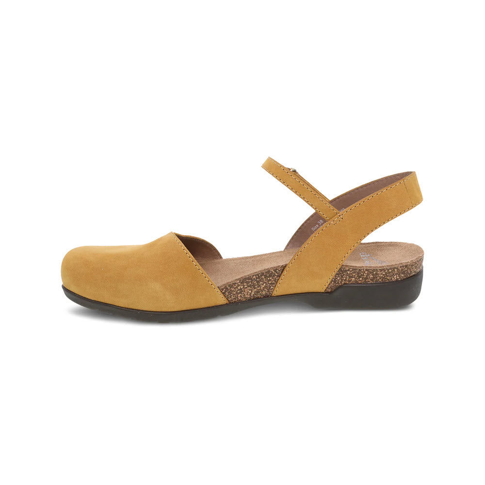 A yellow Dansko Rowan mustard - womens summer sandal with crossover straps and a cork sole, isolated on a white background.