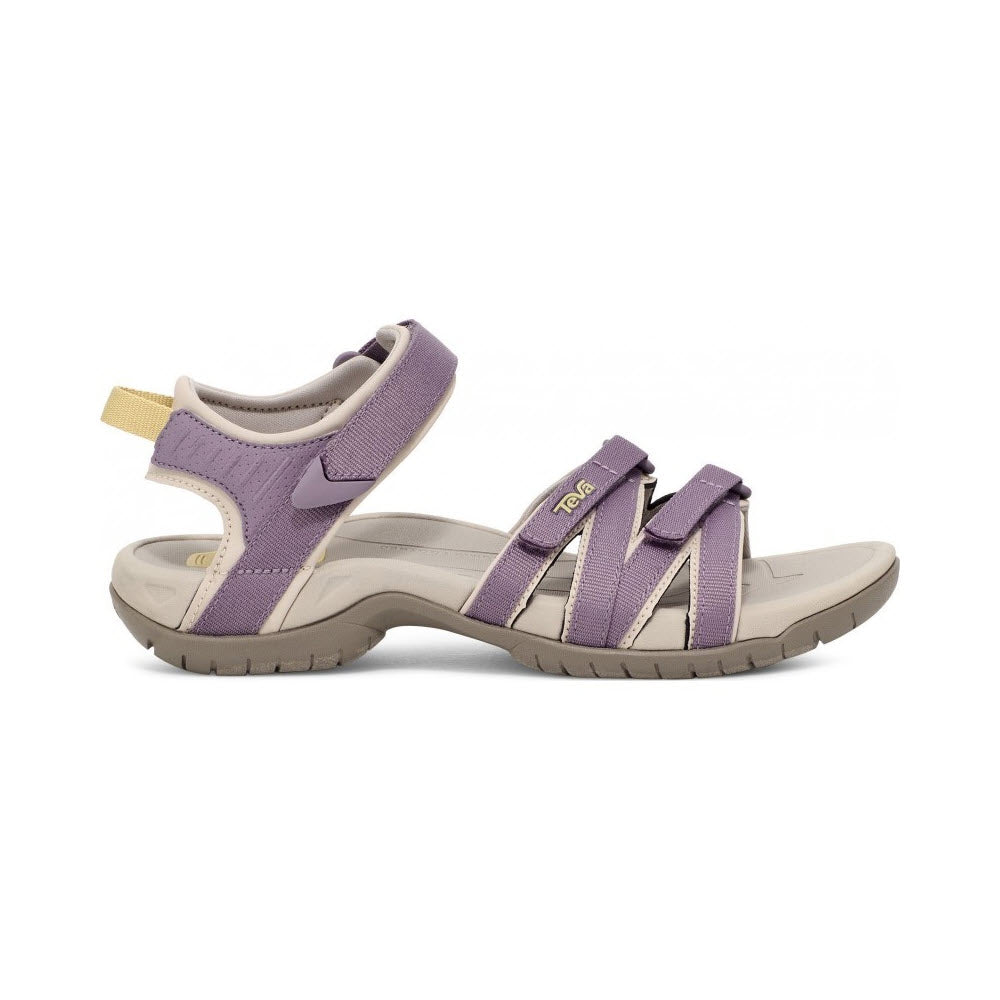 A pair of Teva women&#39;s purple and gray multi-purpose sports sandals with velcro straps on a white background.
