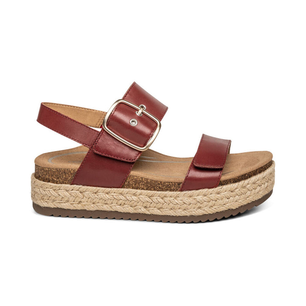 A single Aetrex Vania Red - Womens genuine leather sandal with a buckle, featuring a cork midsole and a braided jute outsole, isolated on a white background.