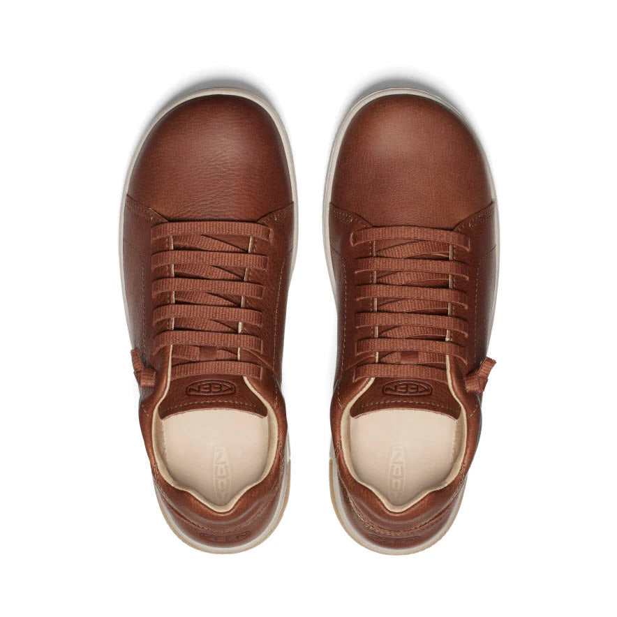 A pair of brown leather Keen KNX lace oxford tortoise shell plaza taupe sneakers with laces, viewed from above.