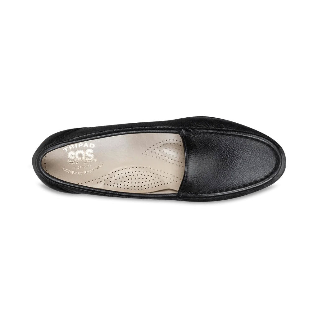 A single SAS SIMPLIFY BLACK - WOMENS leather slipper with a cushioned footbed and a visible inner label, isolated on a white background.