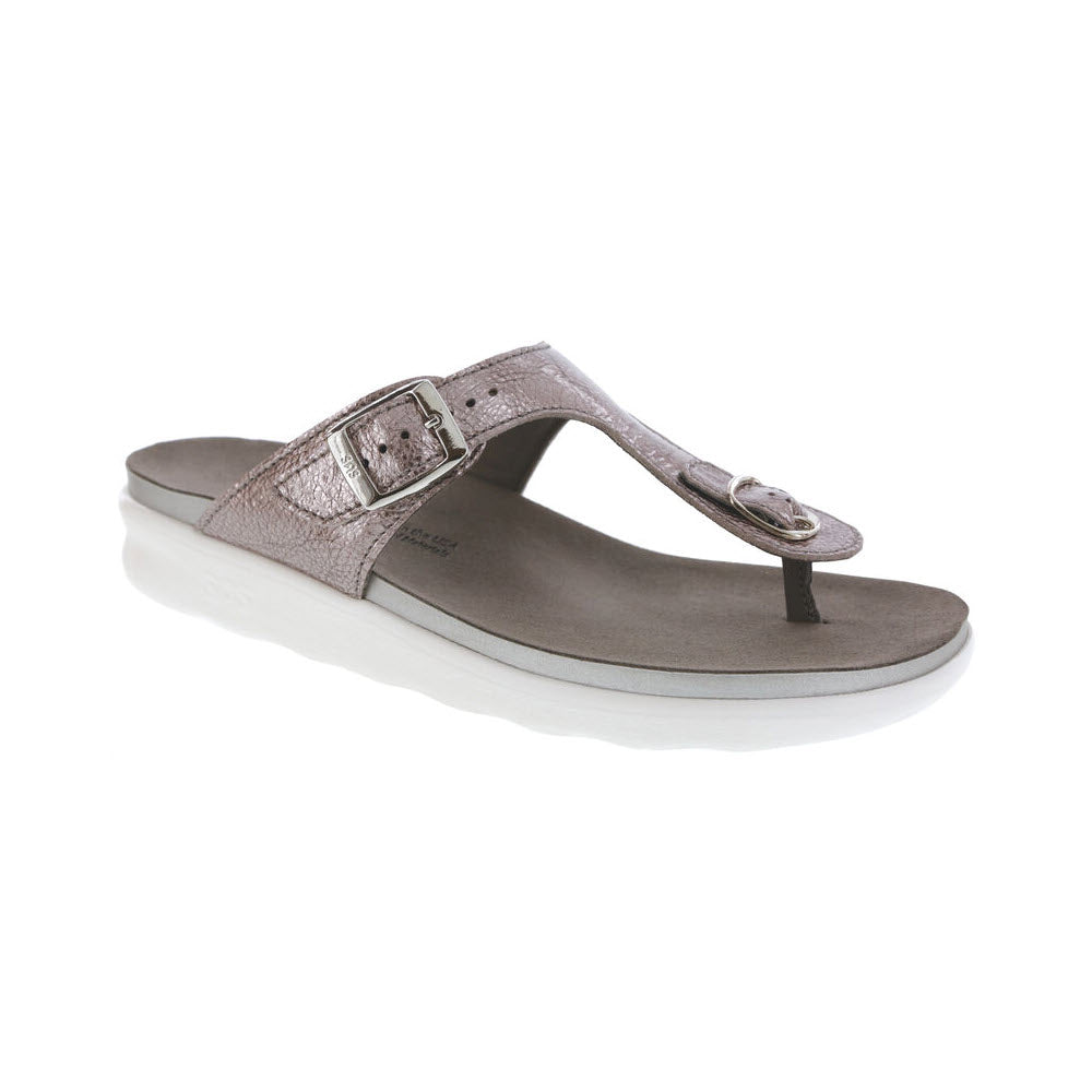 A single SAS SANIBEL WISTERIA women&#39;s sandal in metallic silver with a buckle on the strap, displayed on a white background.