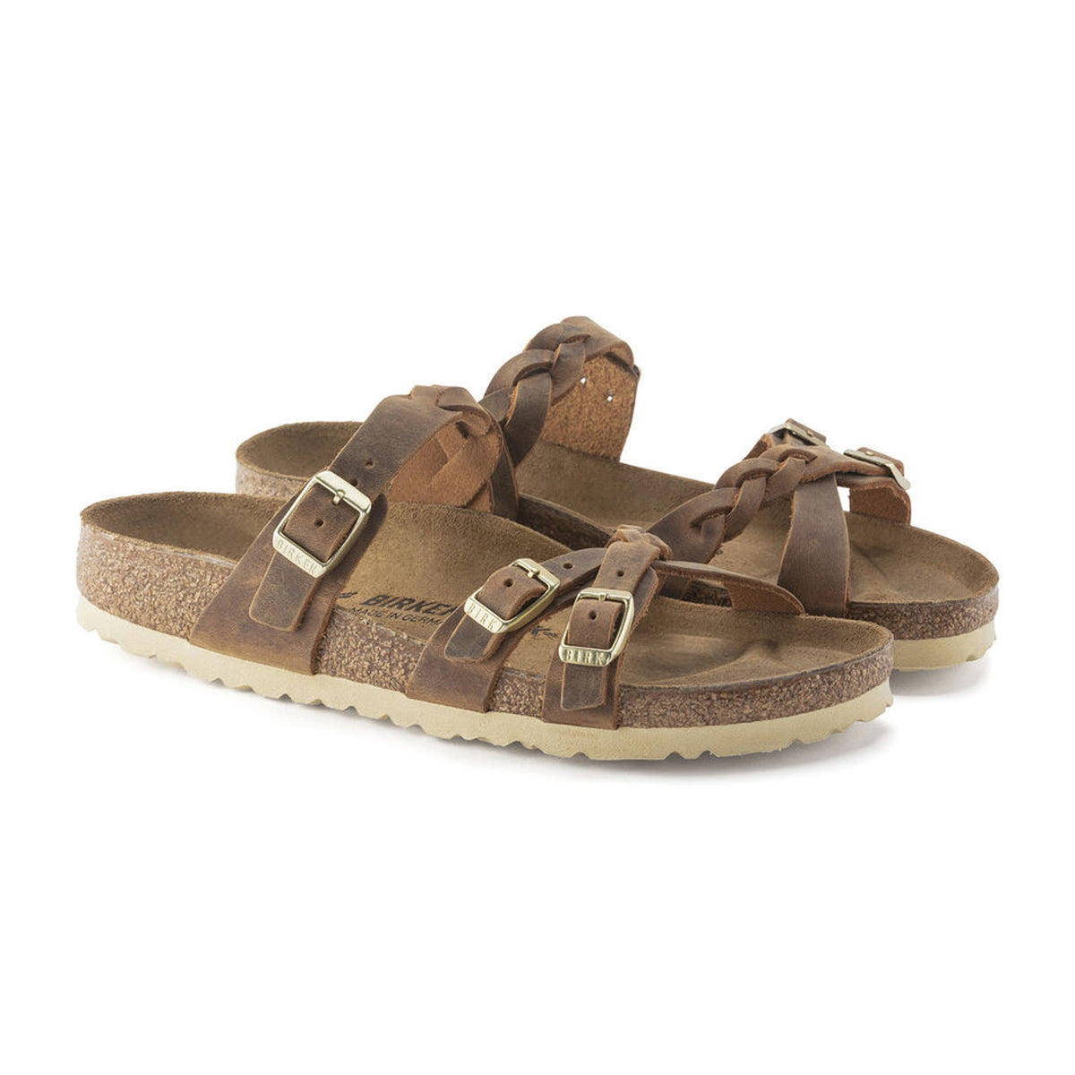 A pair of Birkenstock Franca Braid Cognac - Womens sandals with multiple buckles and cork soles, isolated on a white background.