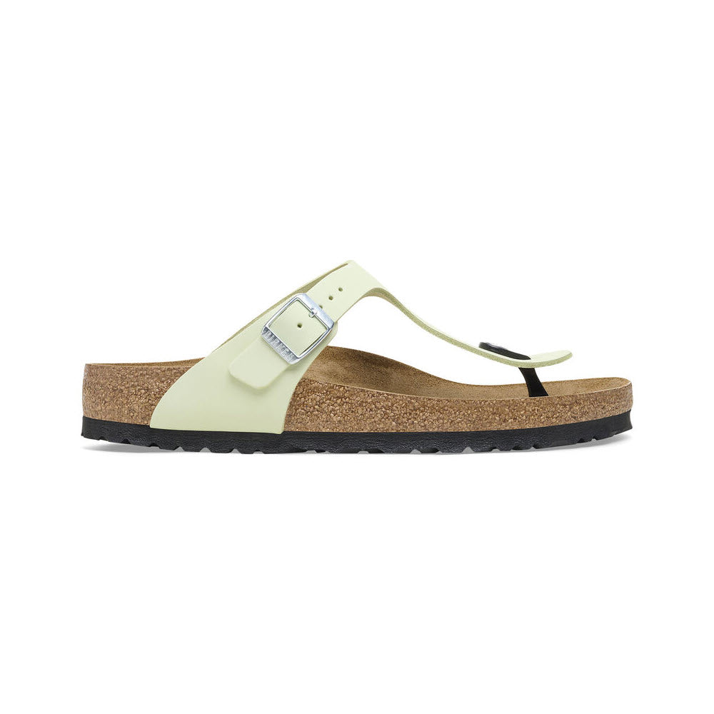 Light green Birkenstock Gizeh Faded Lime sandal with a cork sole and a single strap over the foot, featuring a black toe loop and a small buckle.