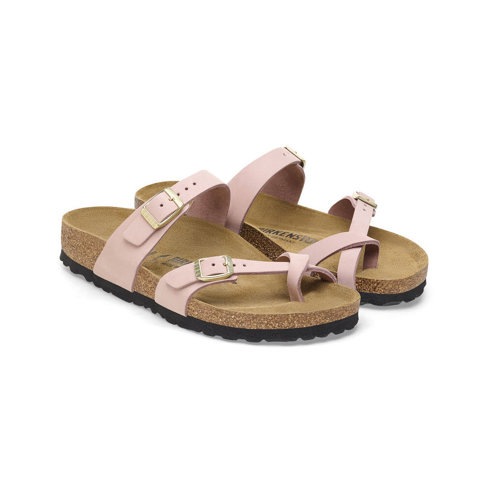 A pair of Birkenstock Mayari Soft Pink sandals with buckle straps and a cork-latex footbed, displayed on a plain white background.