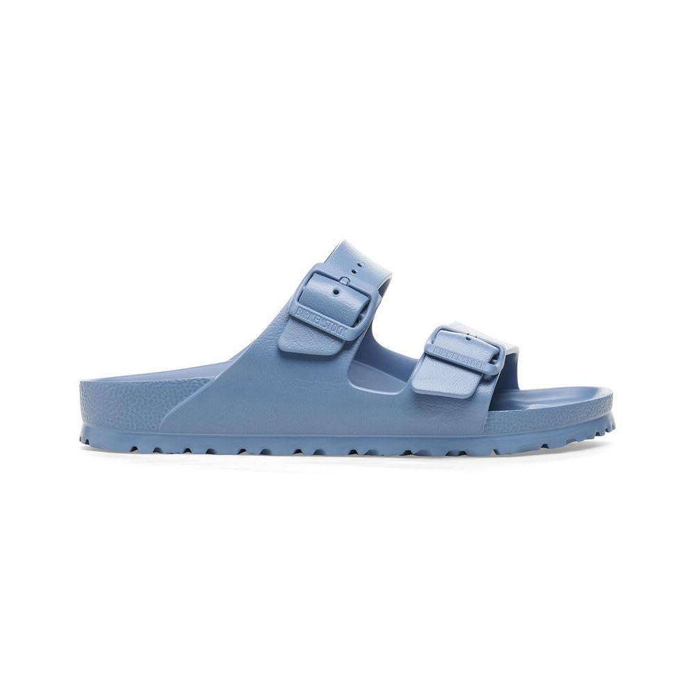 A single pastel blue Birkenstock Arizona EVA Elemental Blue sandal with adjustable straps and a flat sole, isolated on a white background.