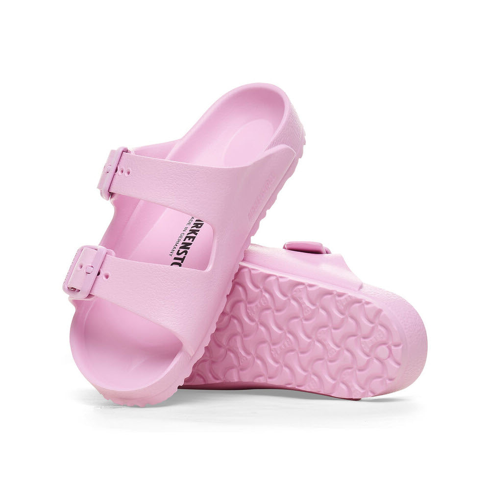 Pink Birkenstock Arizona EVA Fondant Pink sandal with textured sole and adjustable straps, displayed against a white background.