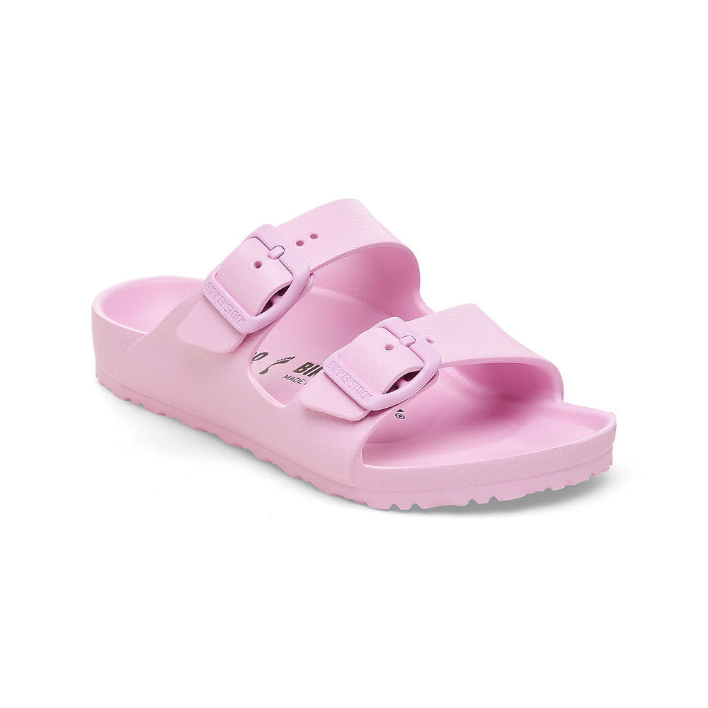 A pair of light pink Birkenstock Arizona EVA Fondant Pink slide sandals with adjustable buckle straps on a white background.