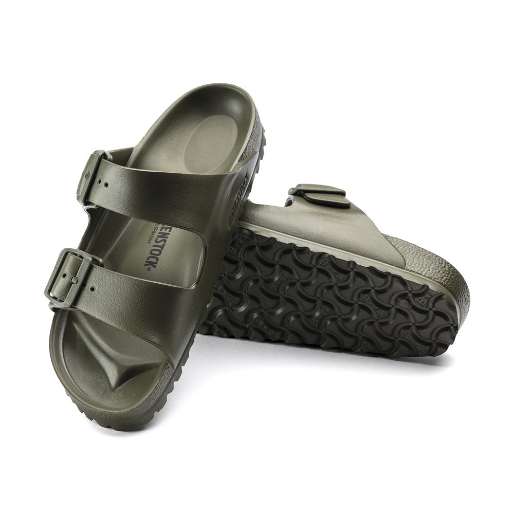 A pair of lightweight EVA sandals styled as Birkenstock Arizona, with buckle closures and a textured sole, displayed on a white background.